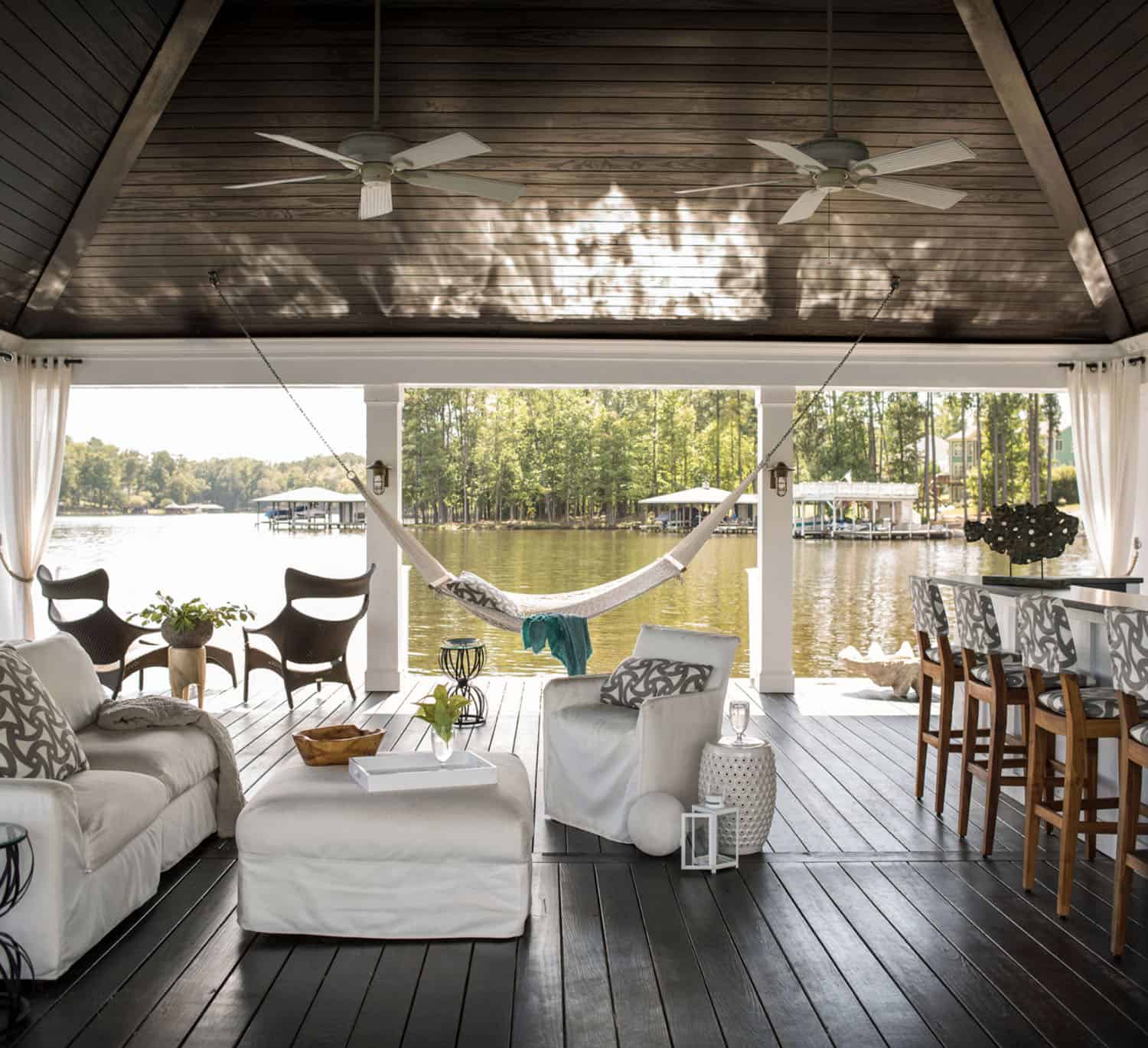 deck with outdoor furniture and a hammock