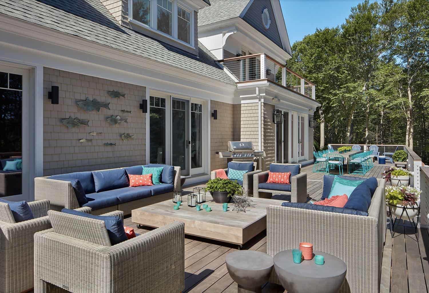 contemporary deck with outdoor furniture and a fireplace