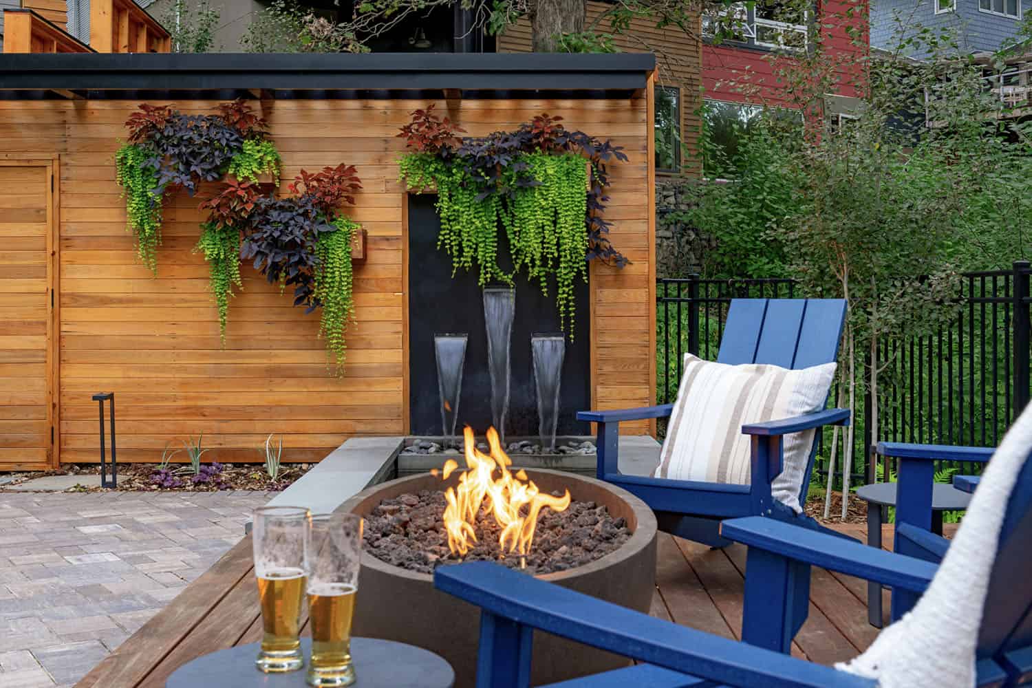 raised ipe deck with a water feature and fire bowl