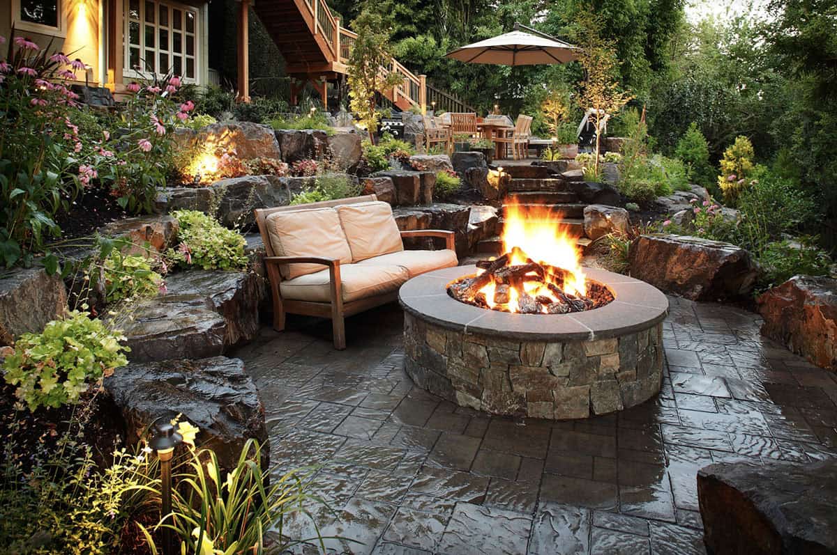 traditional style backyard with a fire pit