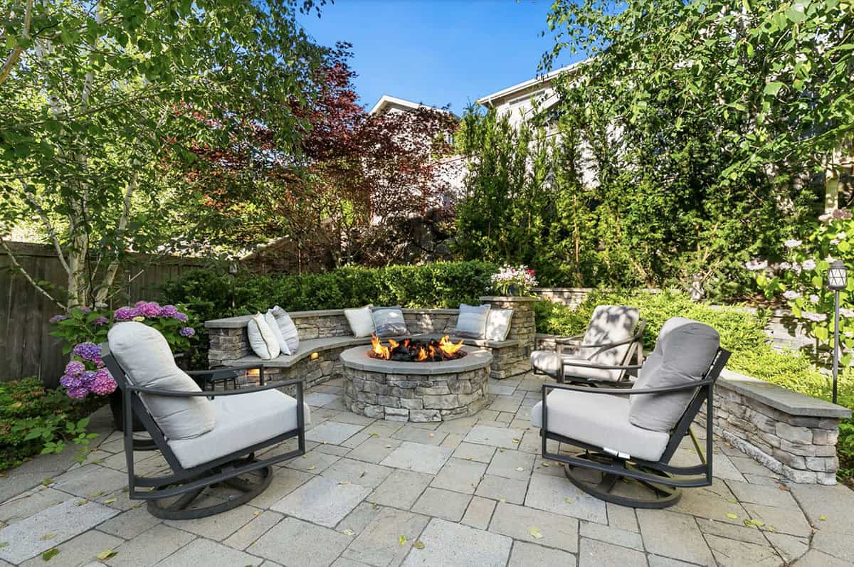 traditional style patio with built-in seating and a fire pit