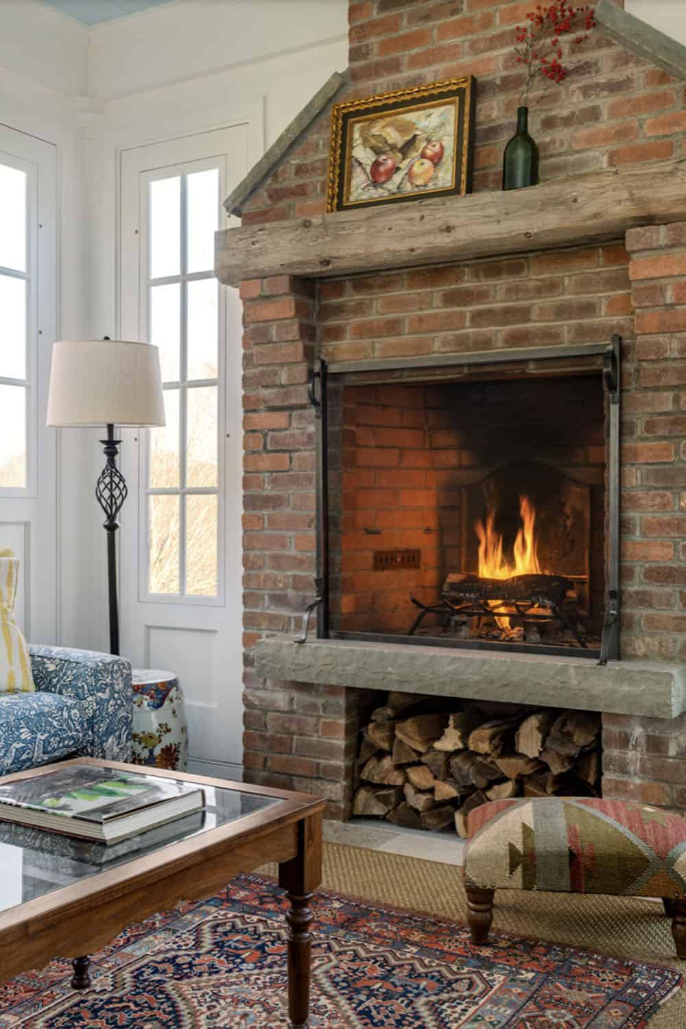three-season farmhouse style sunroom with a fireplace