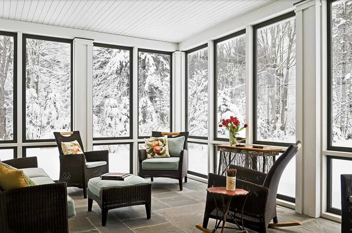 farmhouse style sunroom with views of snow