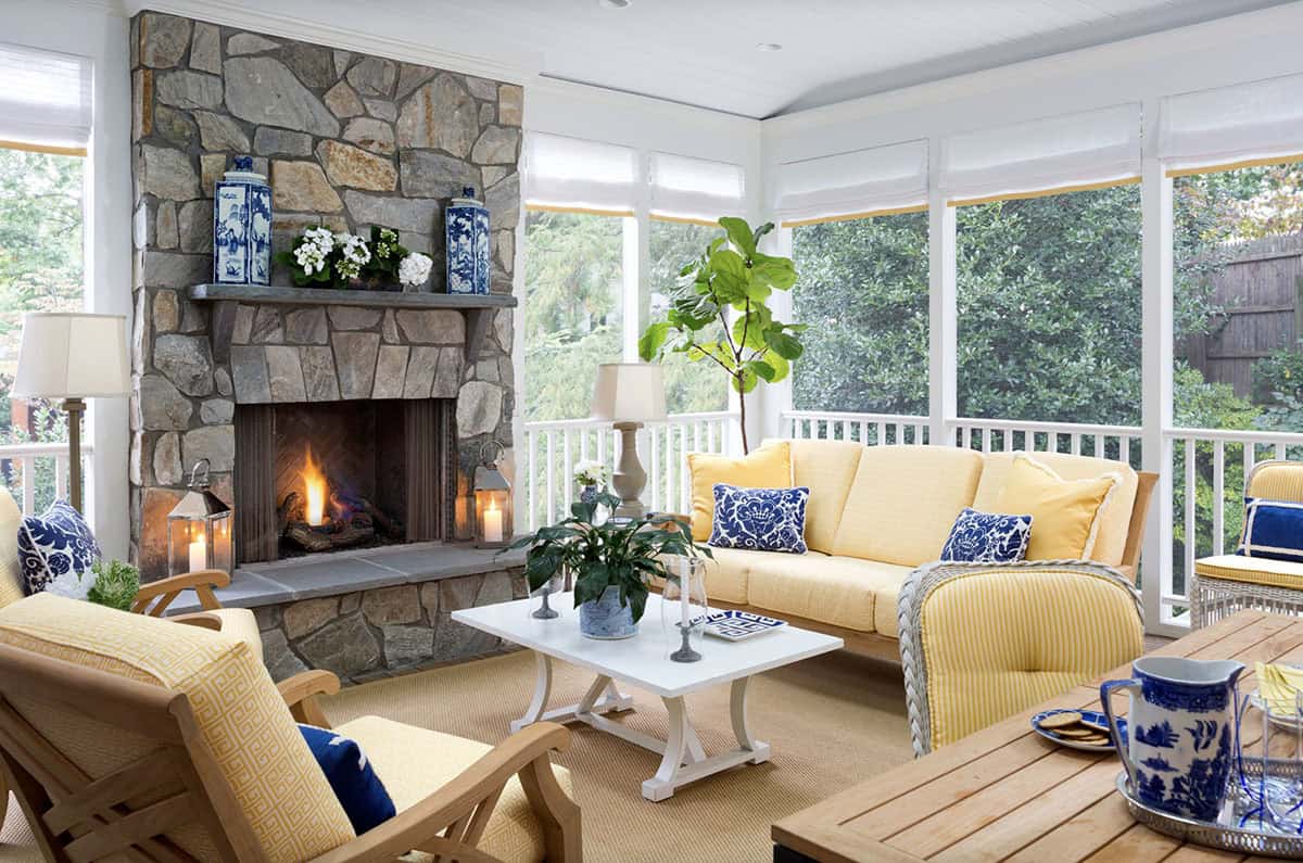 beach style sunroom with a fireplace