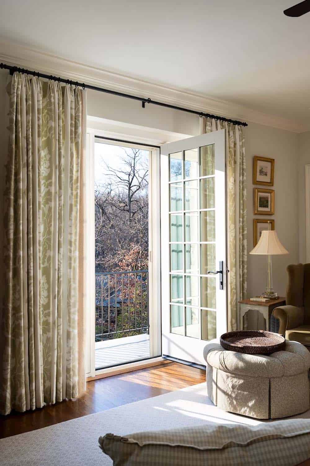 traditional style bedroom with a private balcony