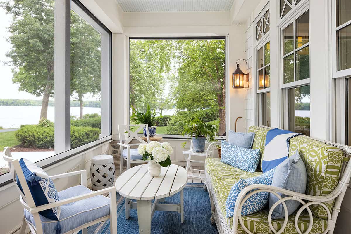 coastal cottage-style home enclosed front porch