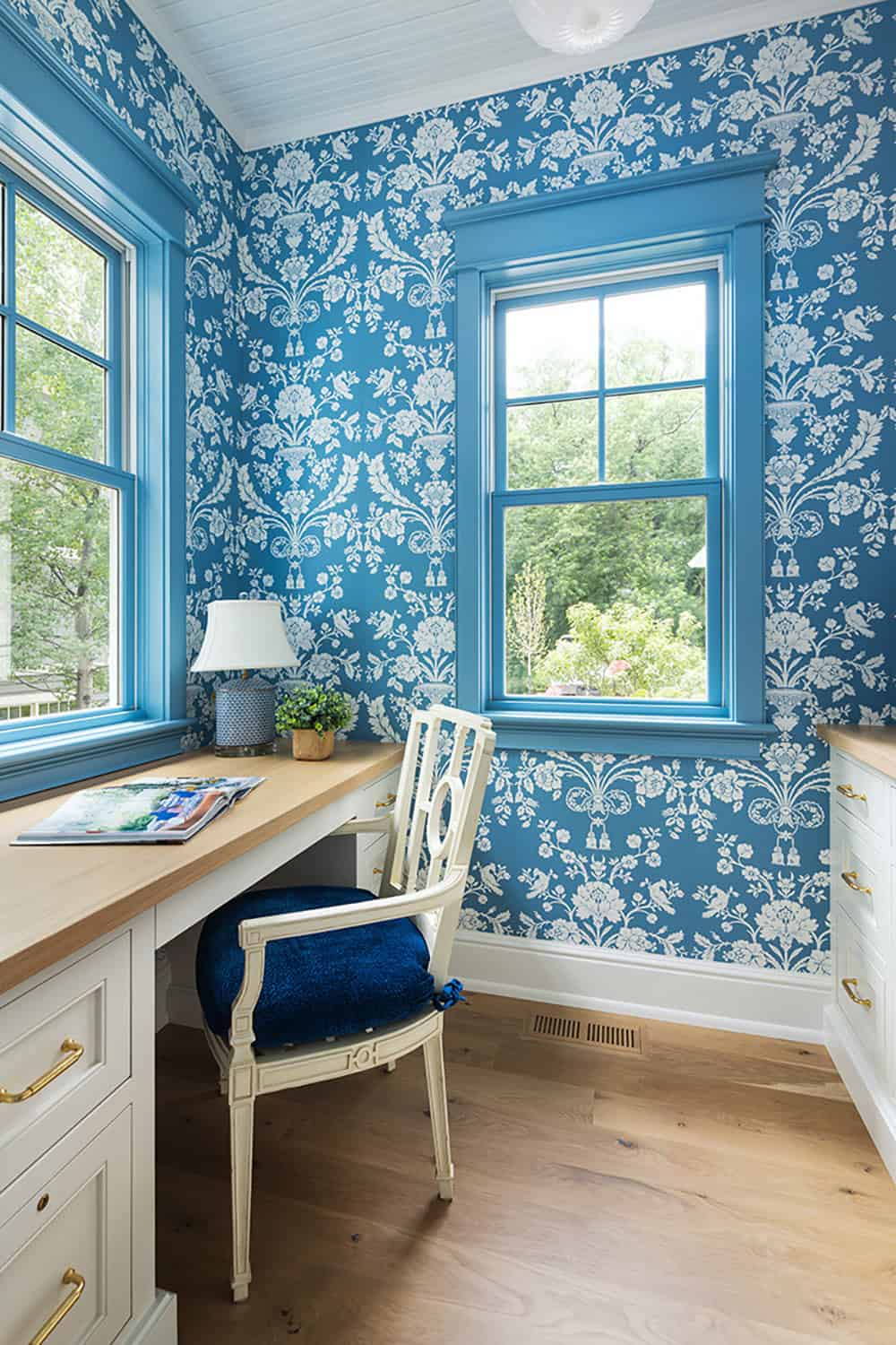 coastal cottage-style home office with blue patterned wallpaper