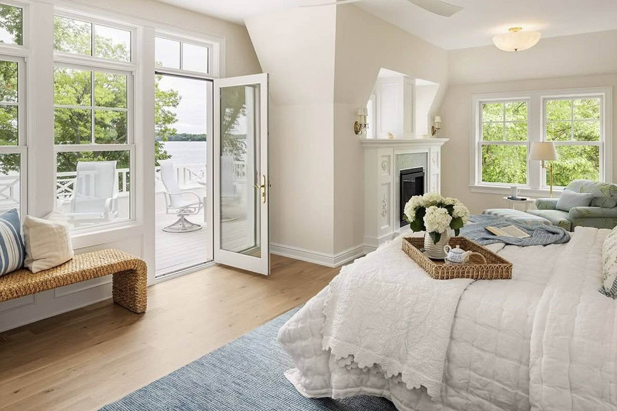 coastal cottage-style bedroom with french doors leading to a private deck