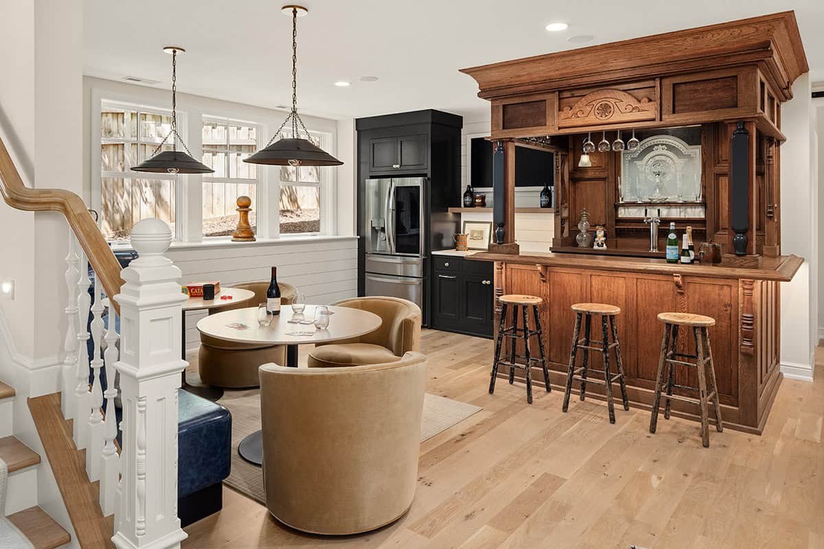 coastal cottage-style home bar with a game room