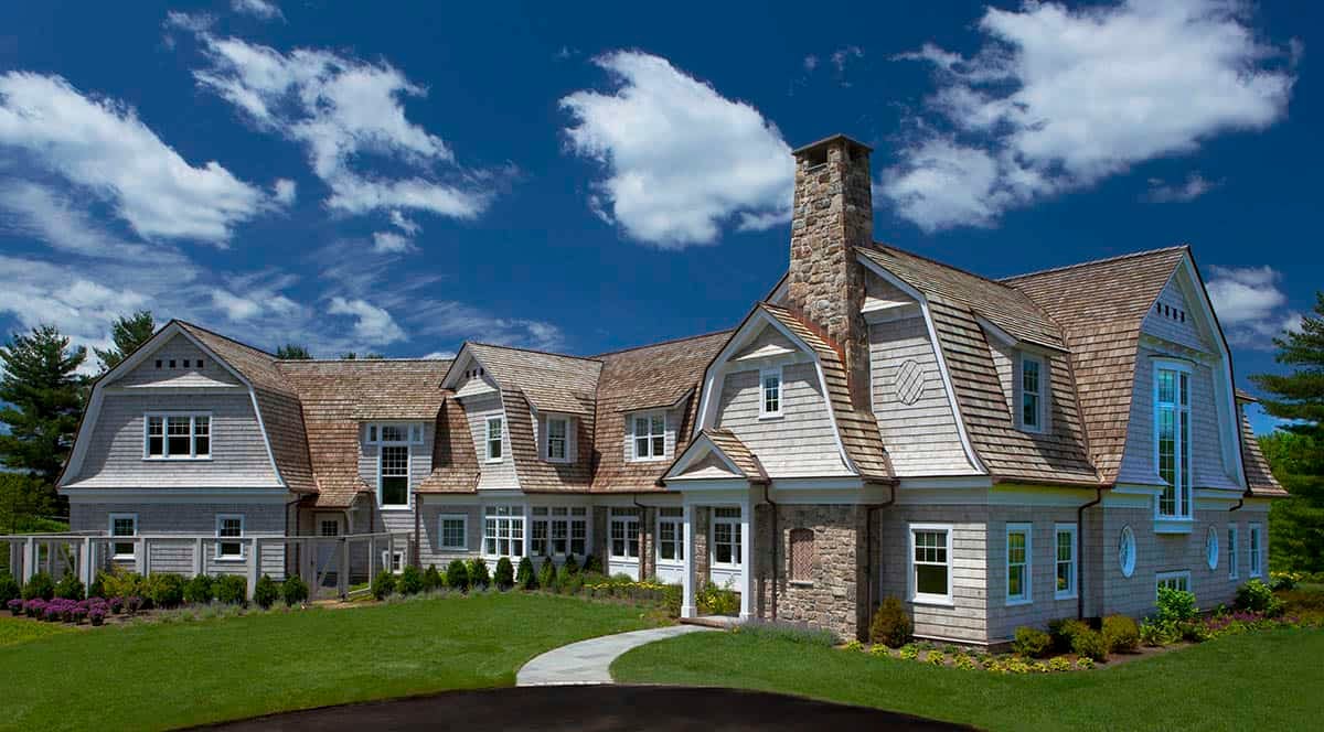 modern country estate exterior with a gambrel roof