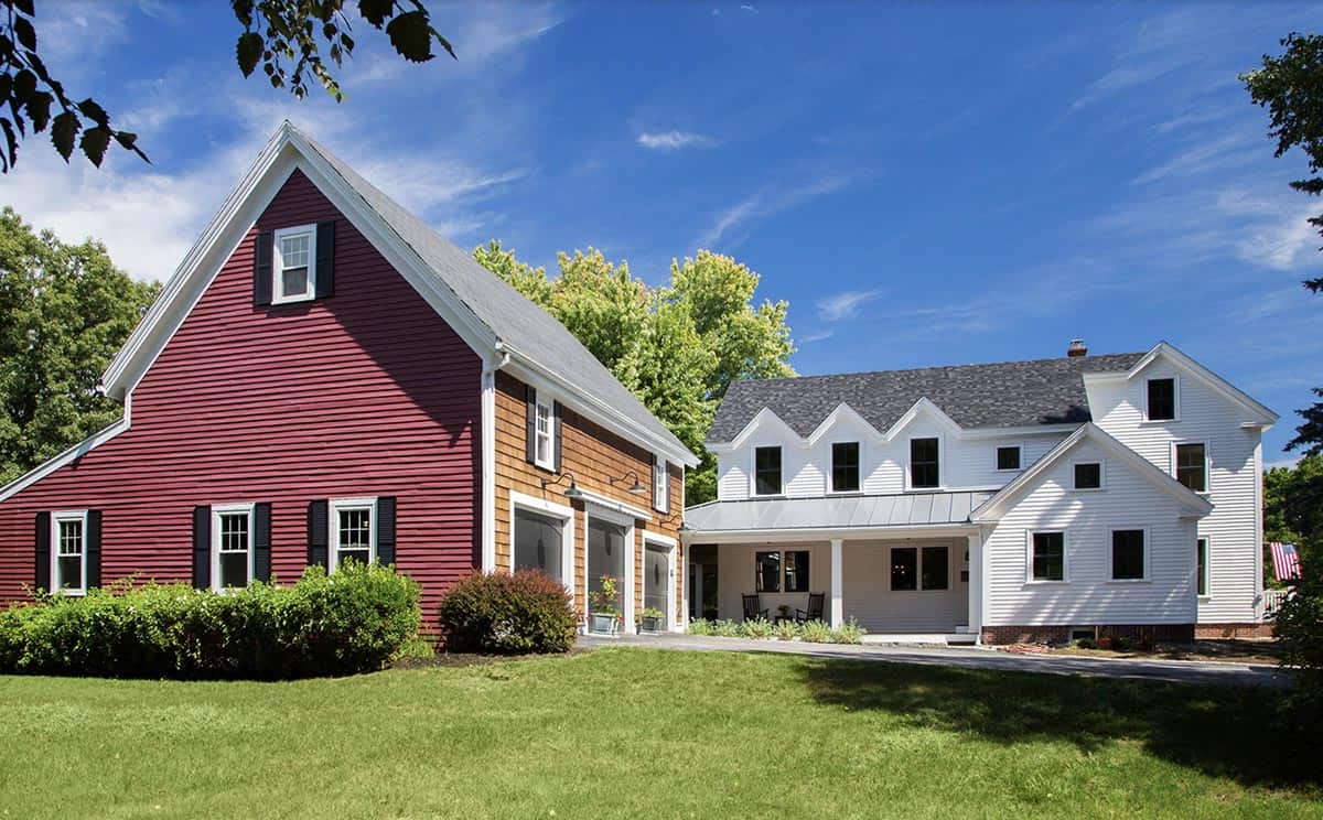 farmhouse style home exterior with a red barn