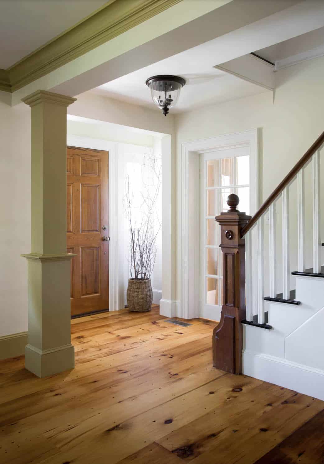 farmhouse style entry with a staircase