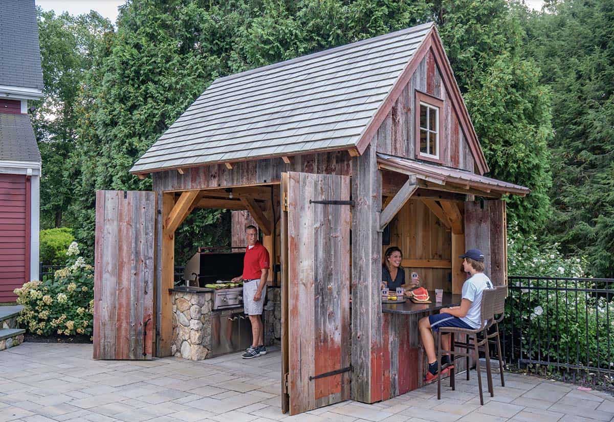 farmhouse style pool house with a home bar and grill