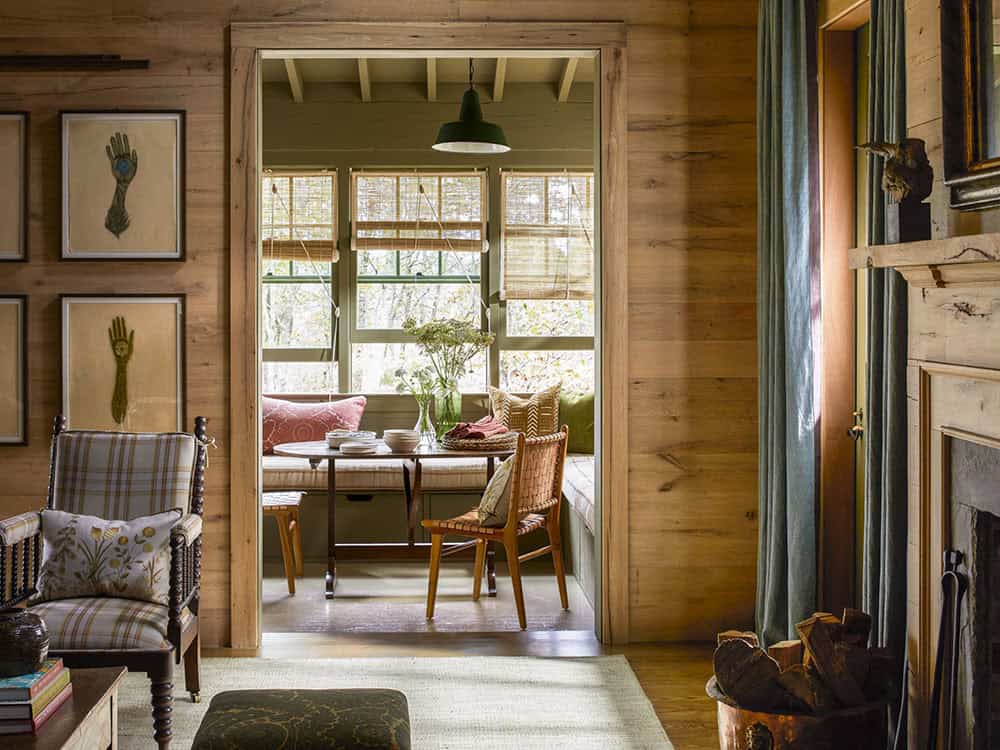 rustic living room looking into the enclosed porch
