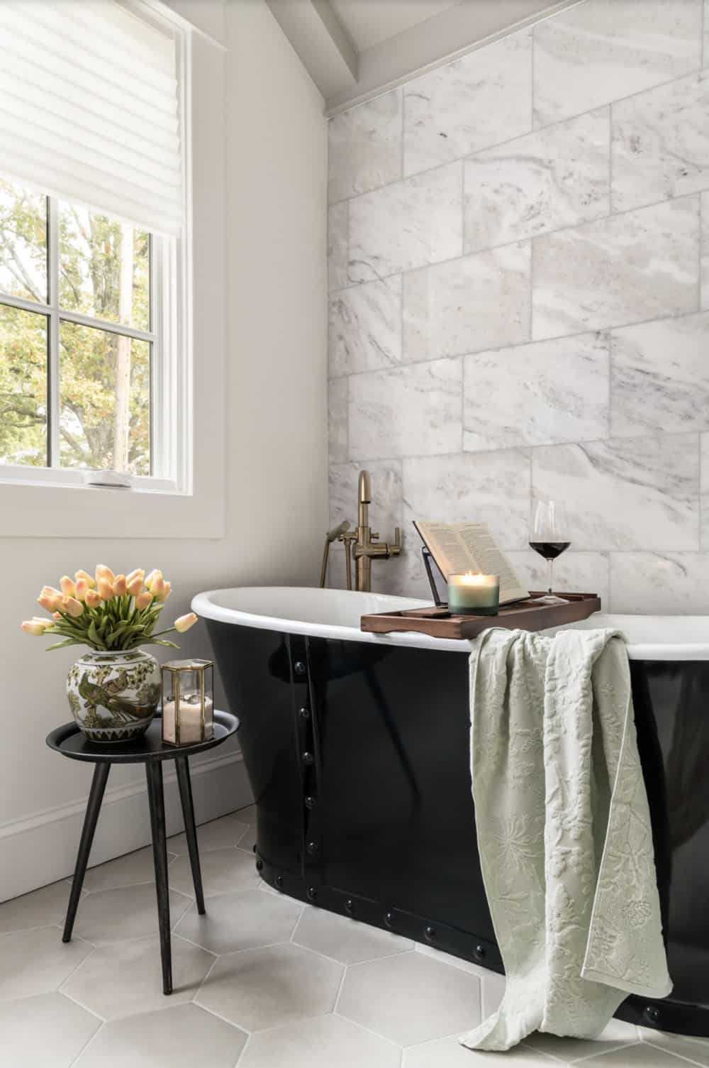 transitional style bathroom with a freestanding tub