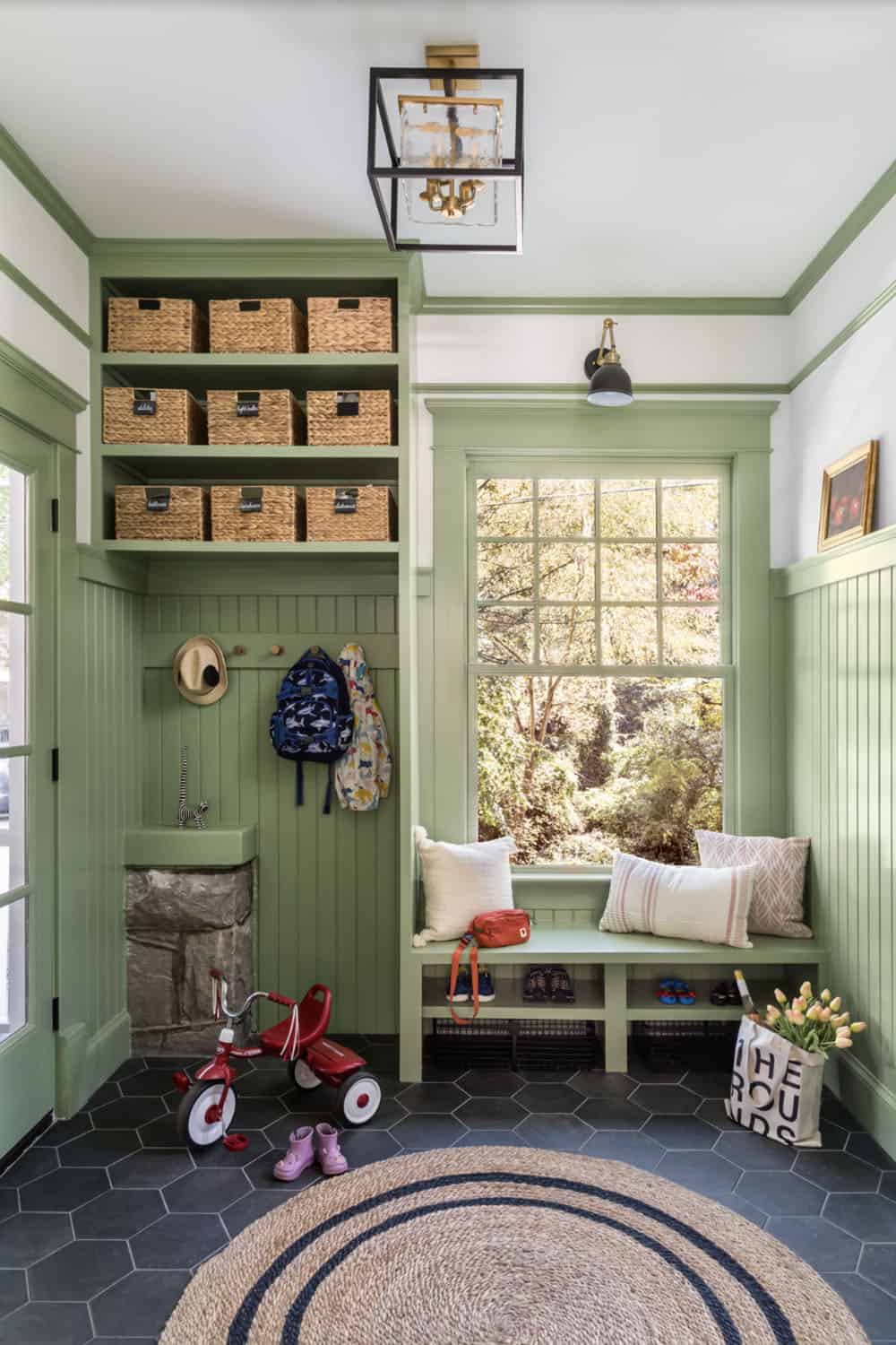 transitional style mudroom entry with a built-in bench