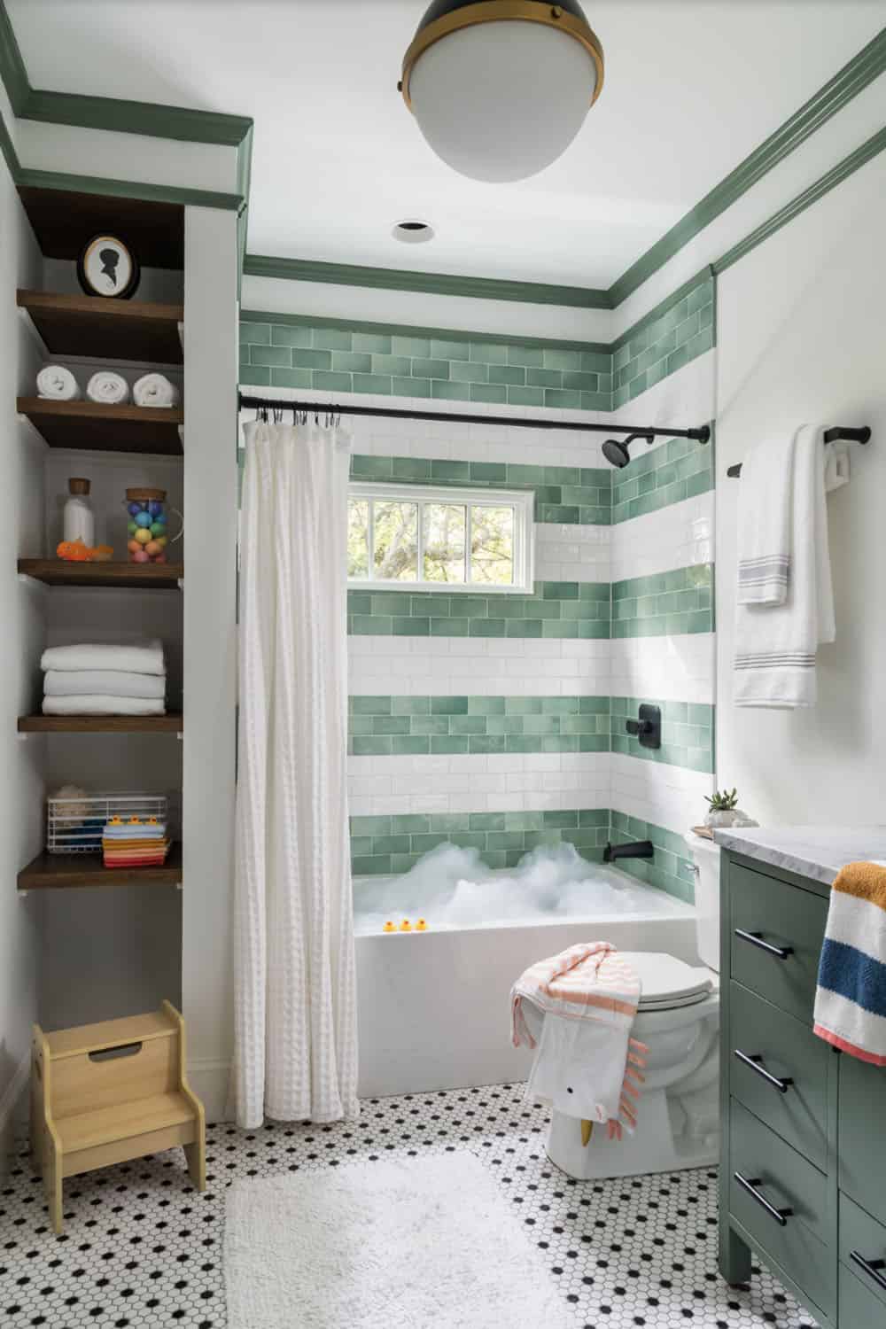 transitional style bathroom with an integrated tub and storage shelves
