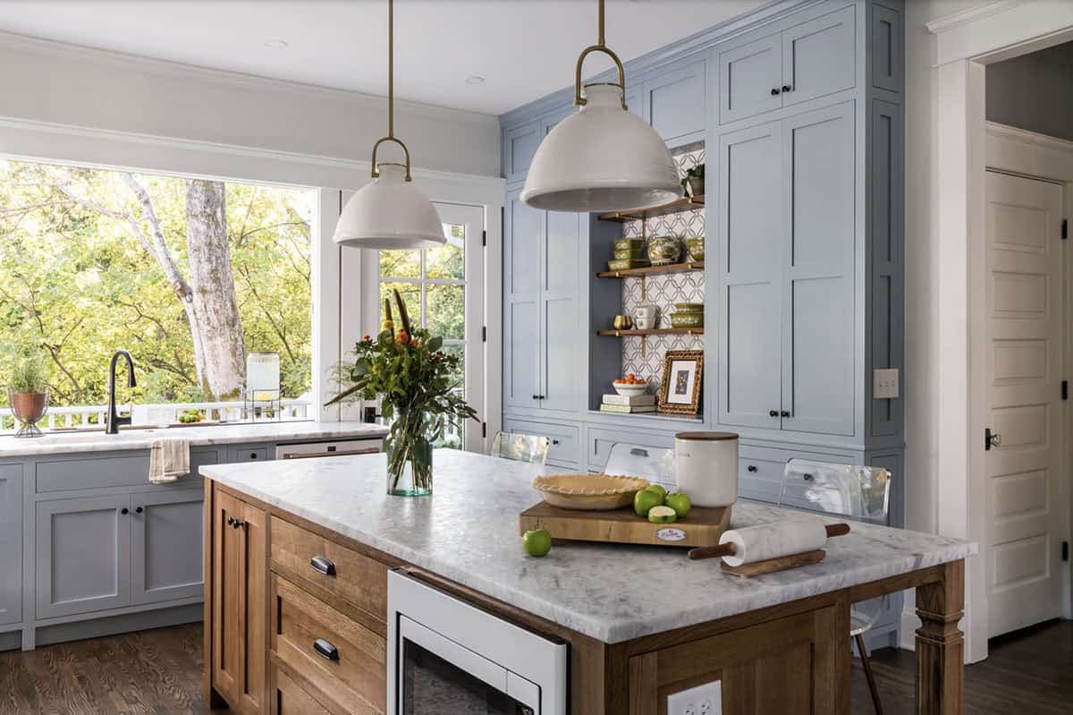 transitional style kitchen with large pendant lights