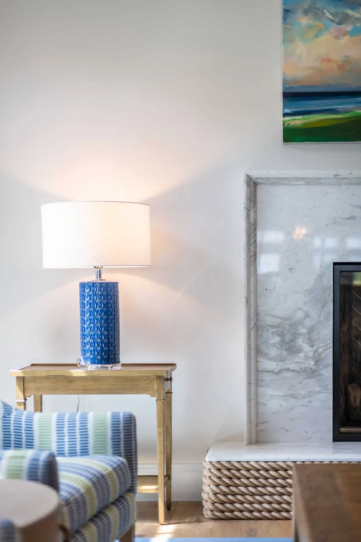 beach style family room with a fireplace