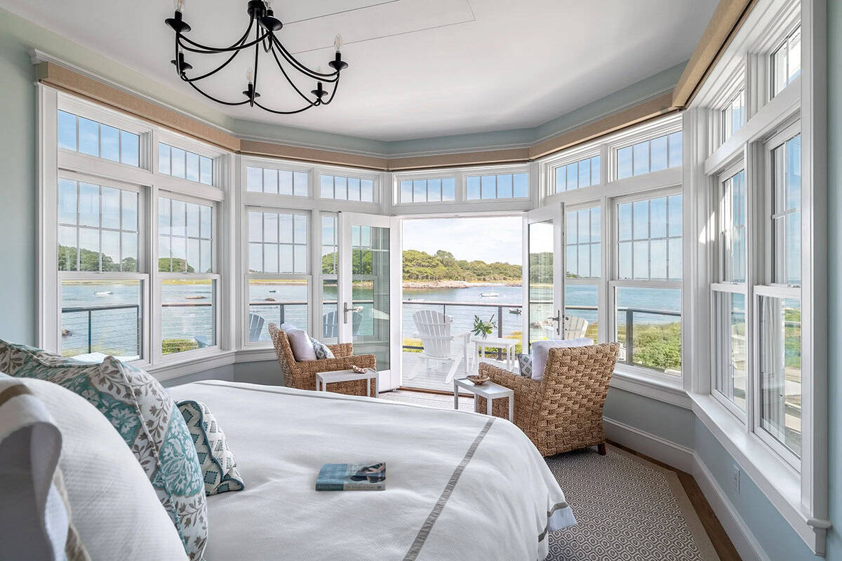 beach style bedroom with french doors and an ocean view