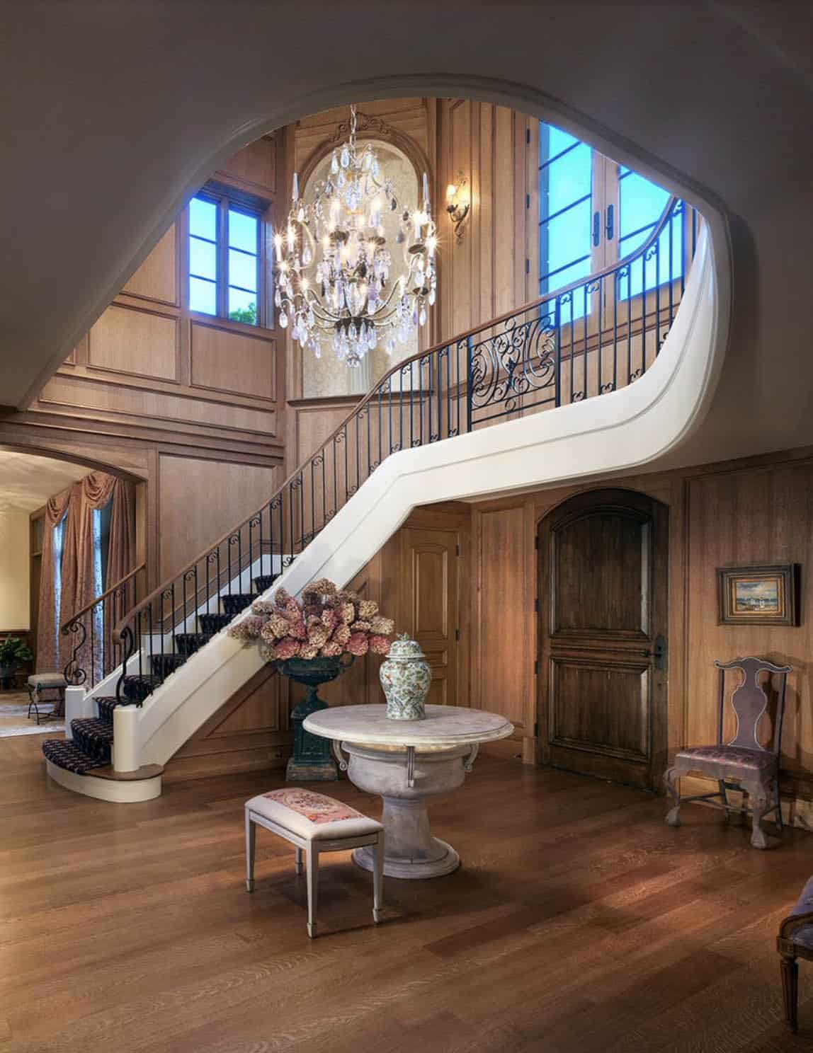 transitiional style entry with a grand staircase