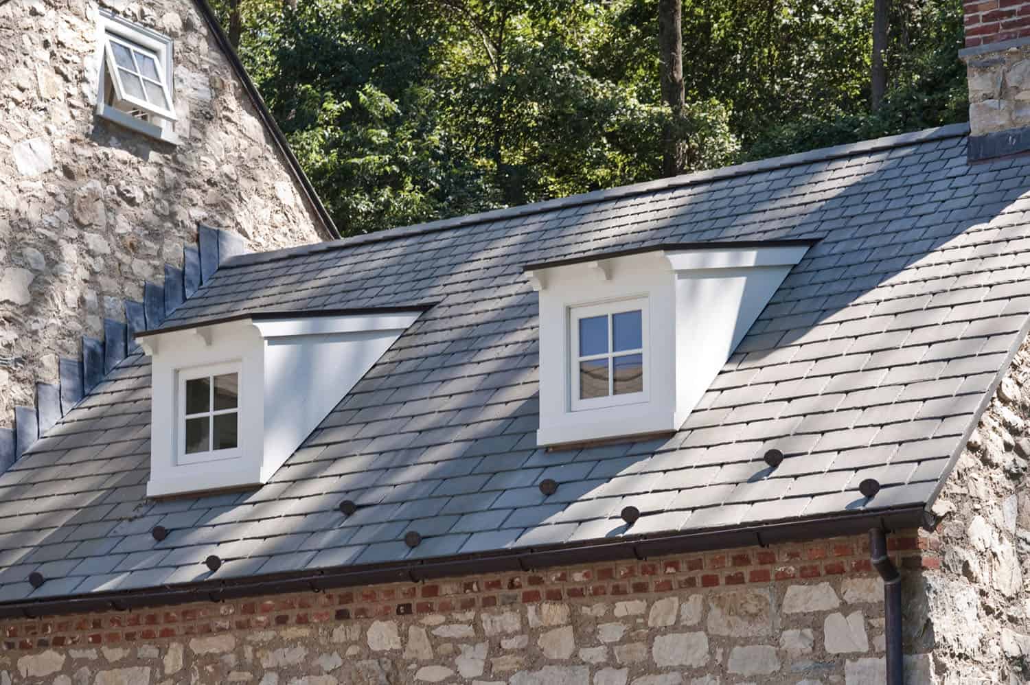 farmhouse exterior roof detail with dormer windows