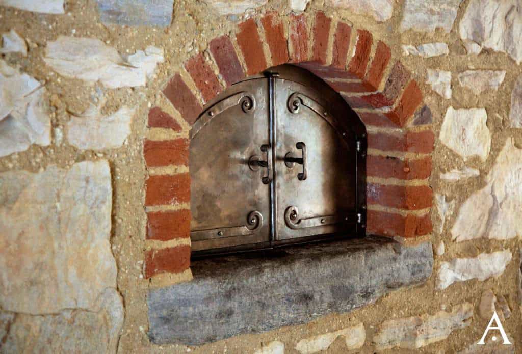 farmhouse style kitchen with a pizza oven