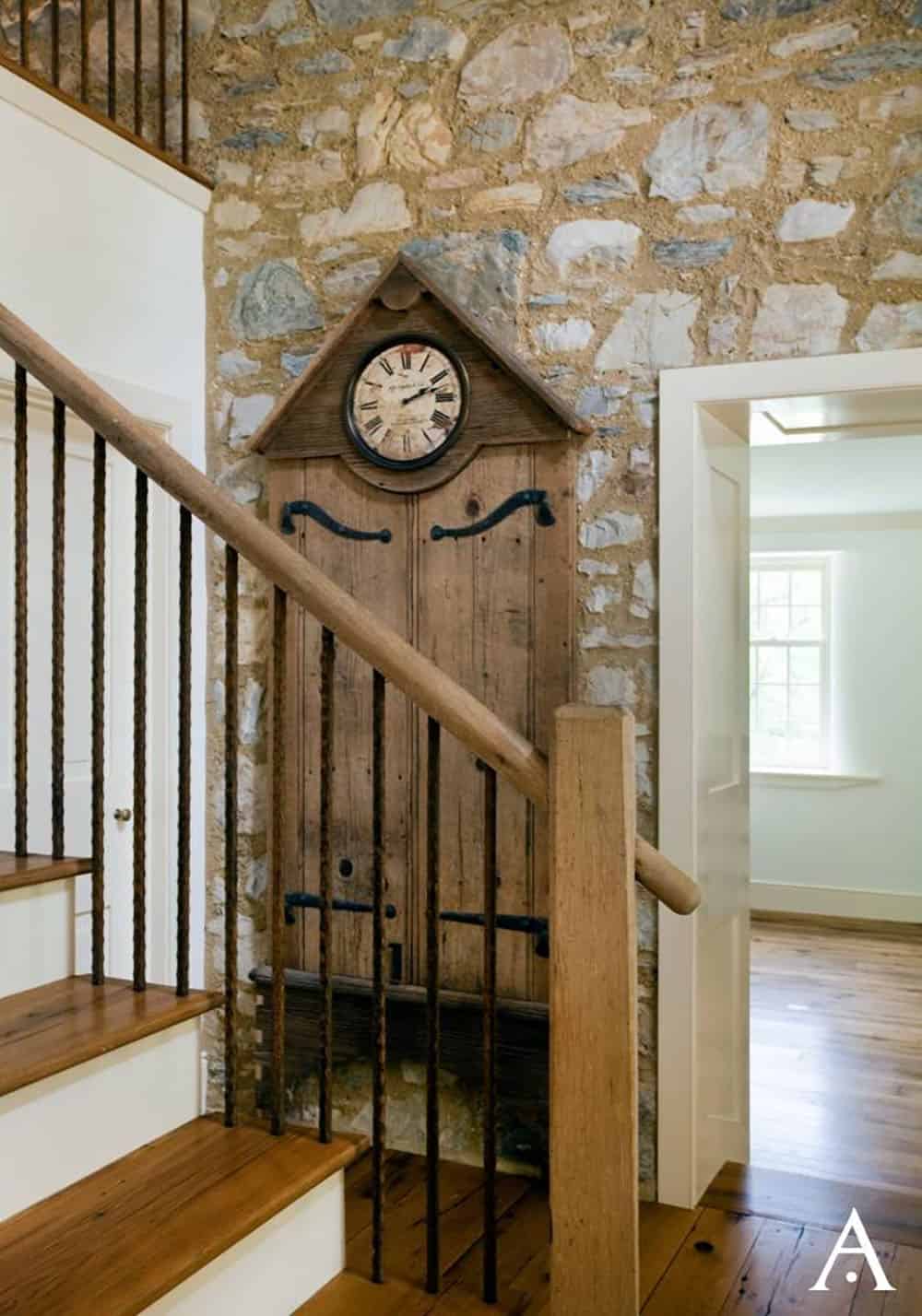 farmhouse style staircase with a grandfather clock