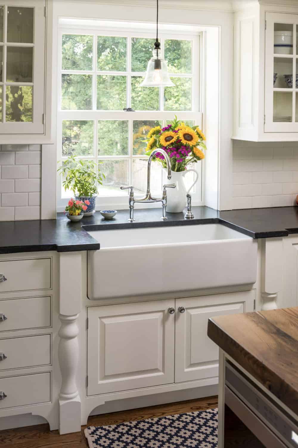 farmhouse style kitchen with a sink and window