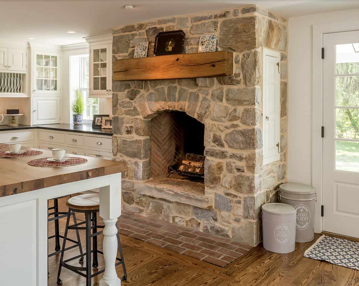 farmhouse style kitchen with a fireplace