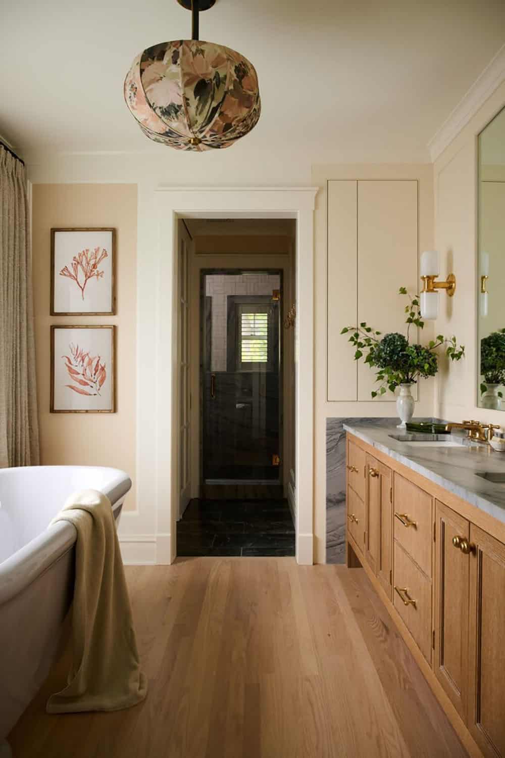 contemporary bathroom with a vanity and freestanding tub