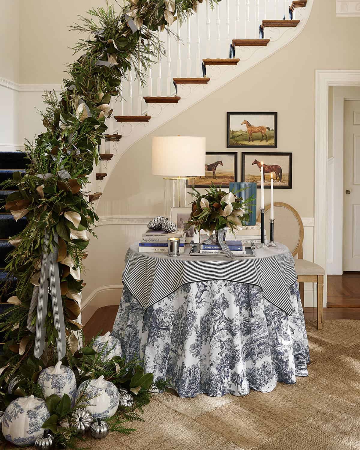 staircase decorated with garland and fall decorations