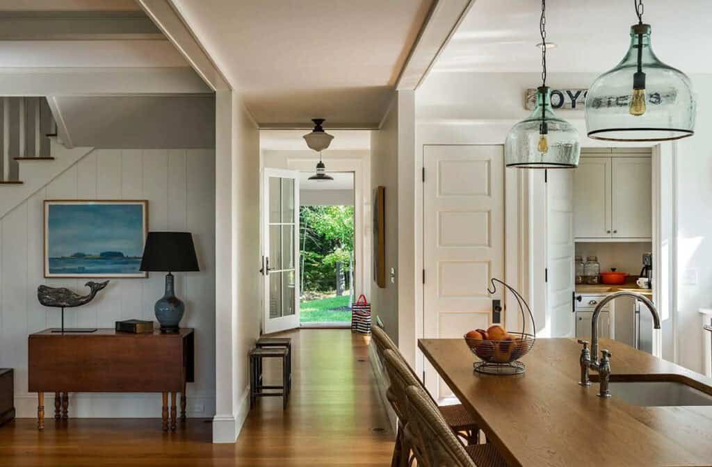 Inside a warm and inviting coastal Maine cottage wrapped in cedar shingles
