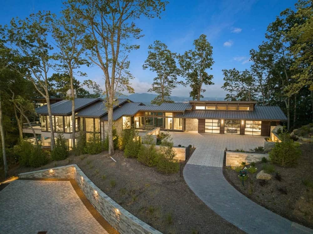 modern mountain home exterior at dusk