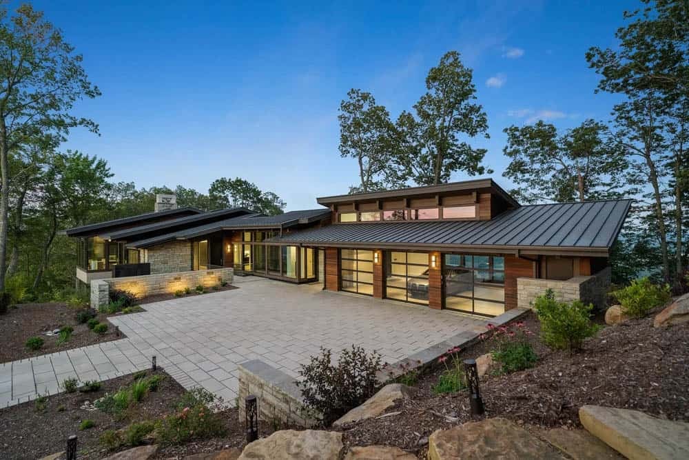 modern mountain home exterior at dusk