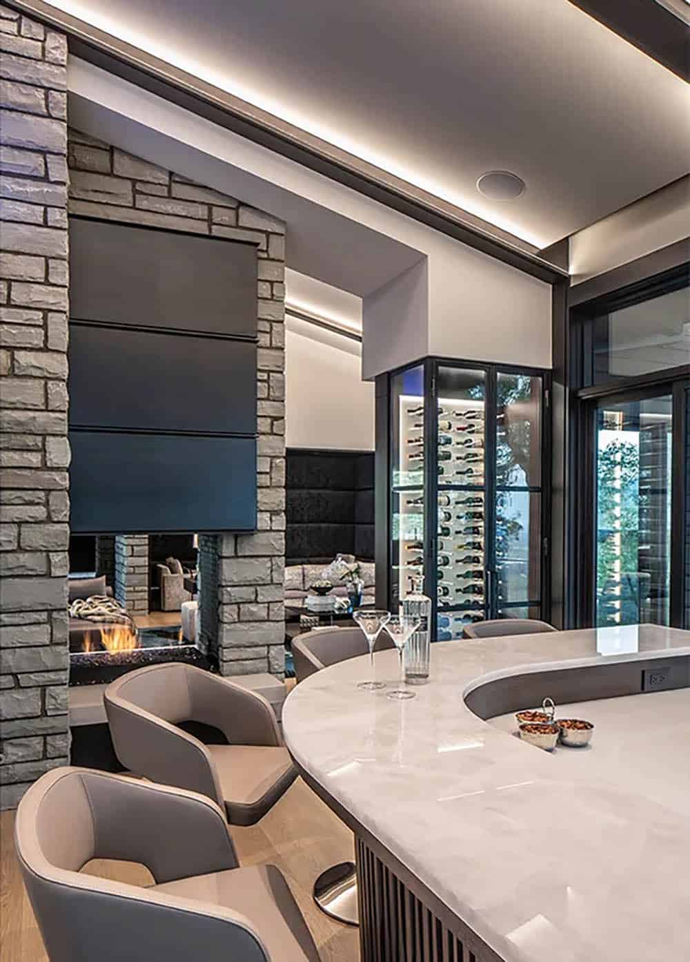 contemporary home bar with a fireplace