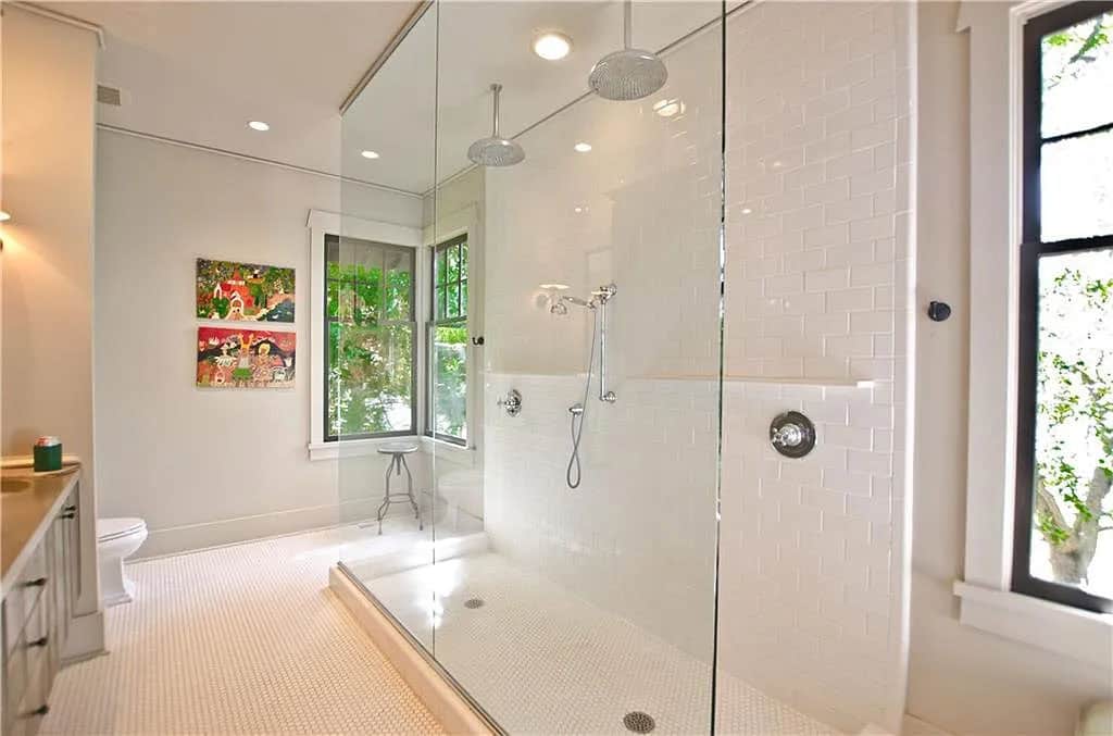 transitional style bathroom with a two sided shower