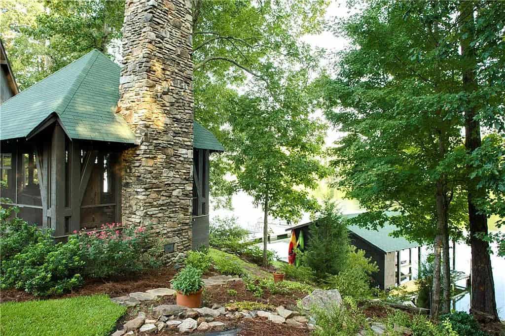 rustic lake house exterior with landscaping