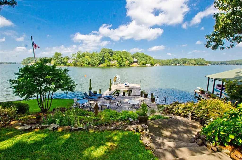 rustic lake house exterior landscaping and a lake view