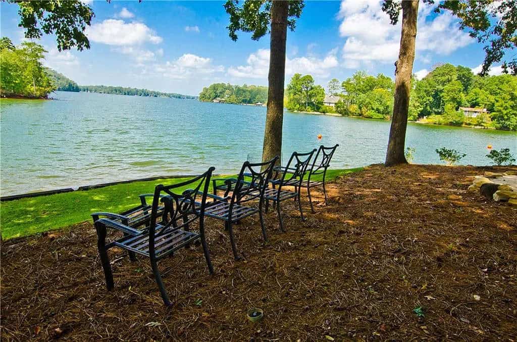 rustic lake house exterior landscaping with a lake view