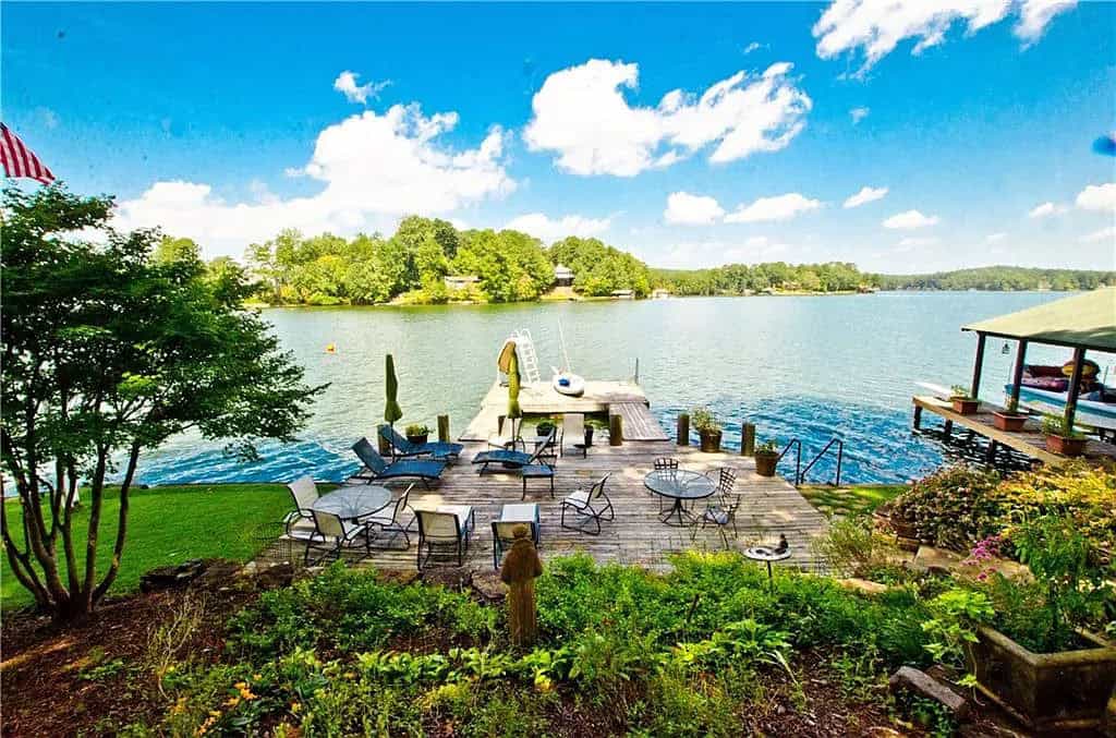 rustic lake house exterior landscaping and a lake view