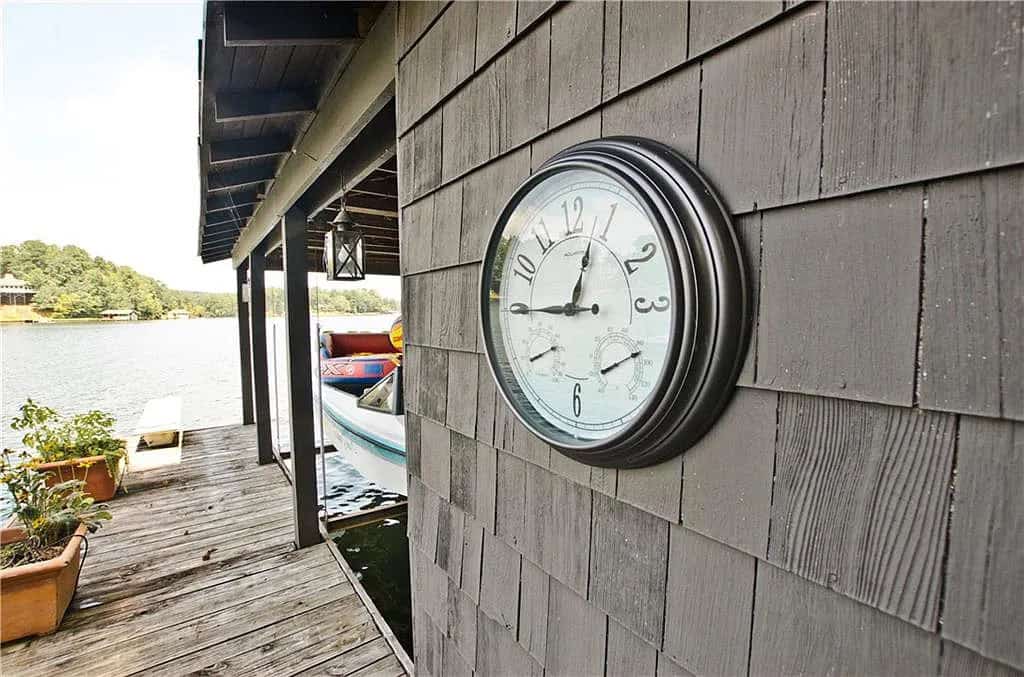 rustic lake house exterior boat house exterior with a wall clock