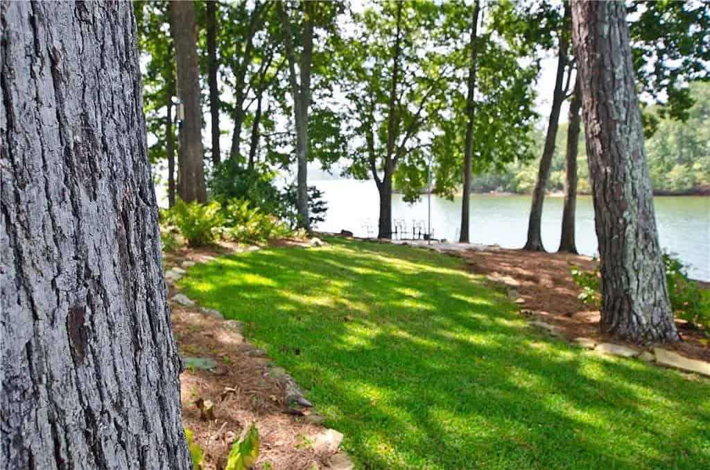 rustic lake house exterior with landscaping