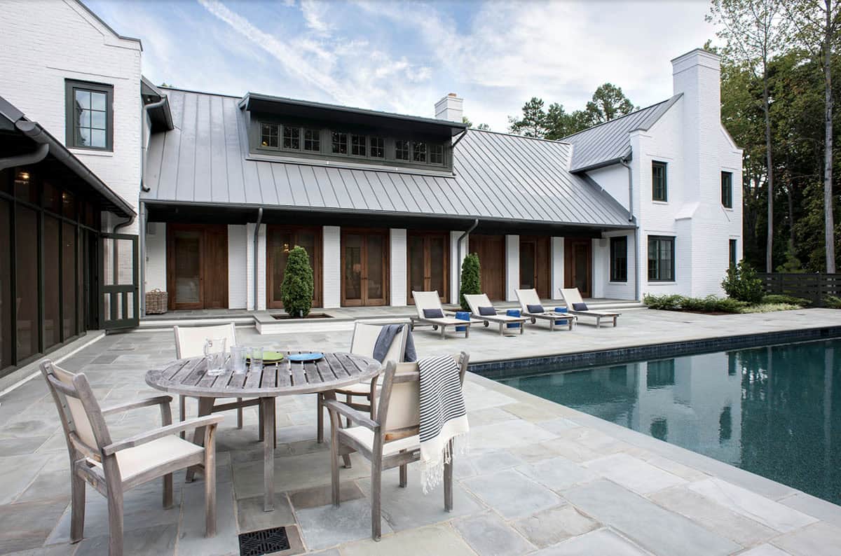 modern farmhouse home exterior backyard with a pool