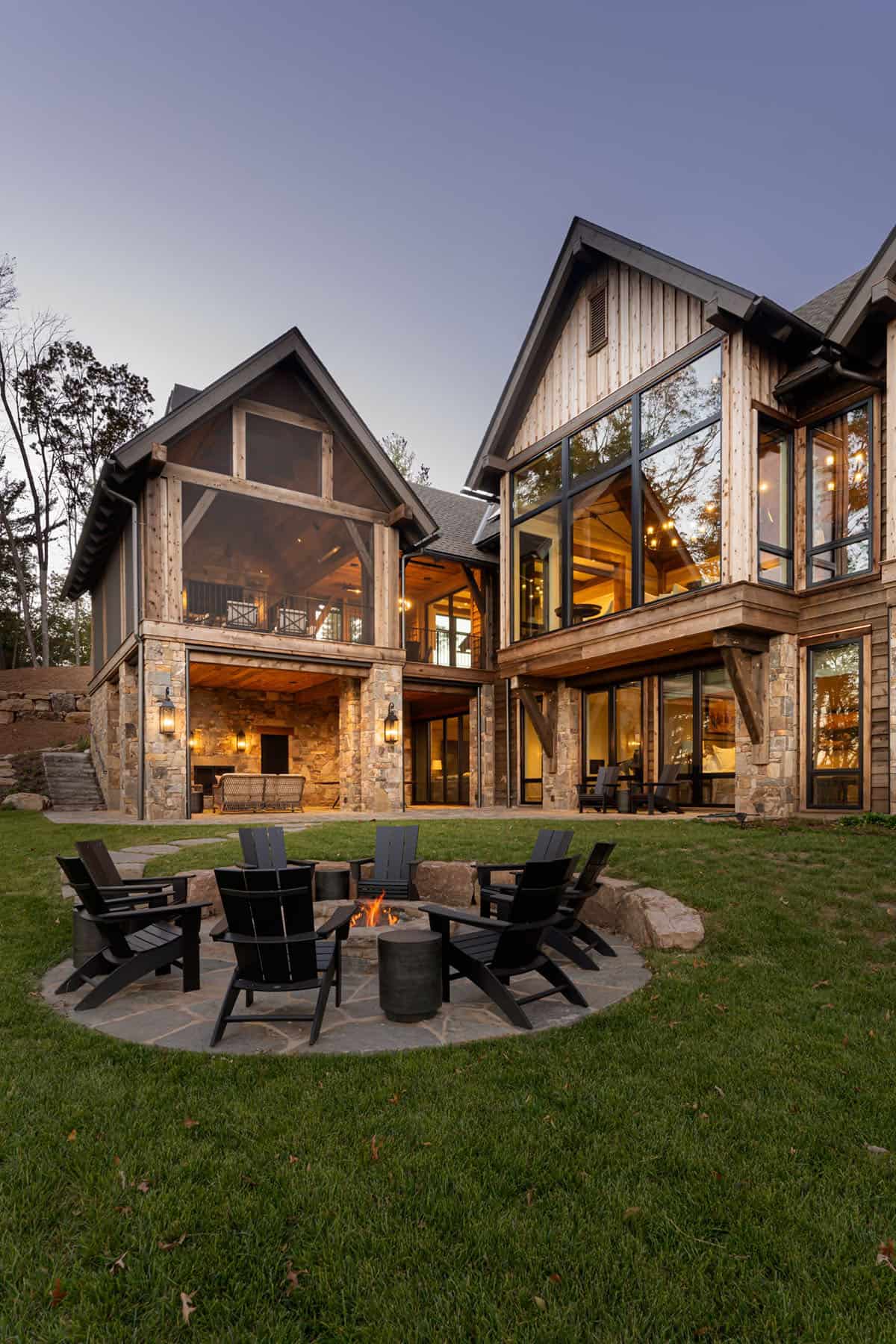 mountain home exterior backyard fire pit with adirondack chairs