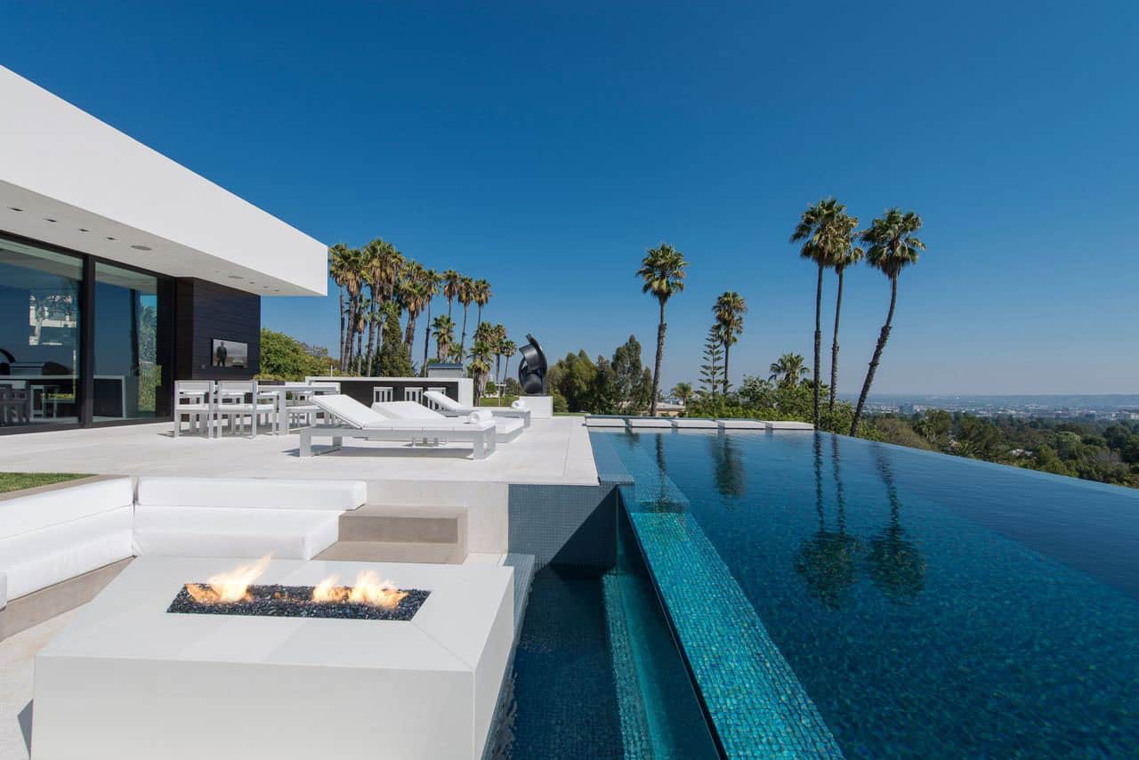 modern home exterior with a patio and pool