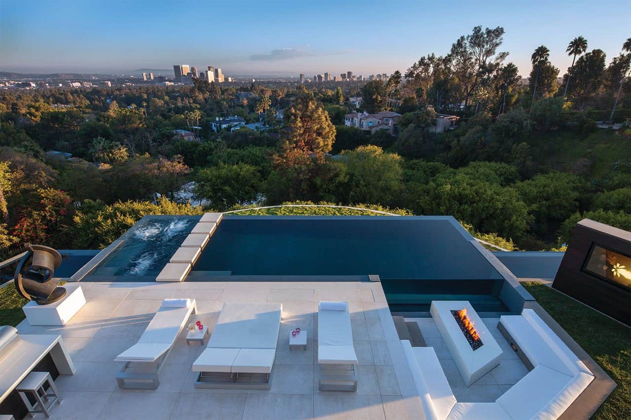 modern home exterior with a patio and pool
