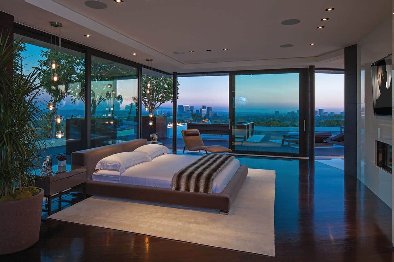 modern bedroom with sliding glass doors and private patio