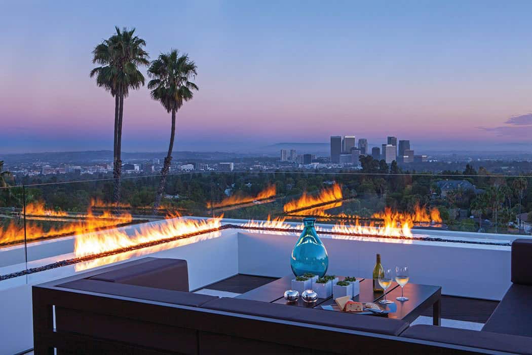 modern pool with a fire feature