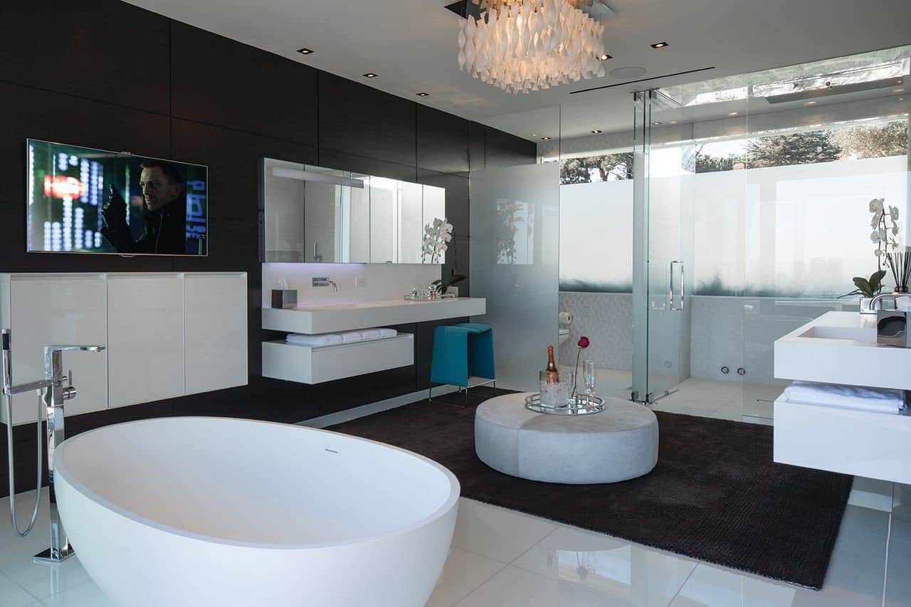 modern bathroom with a vanity and freestanding tub